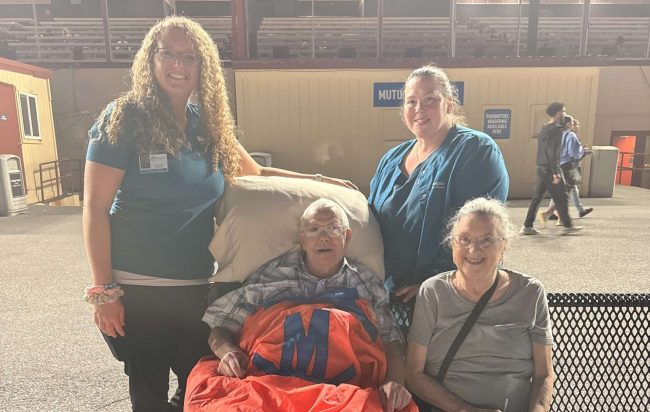 Patient and Transport Team posing for a photo.